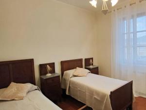 a bedroom with two beds and a window at Colibrì - Villa di Charme in Ferentino