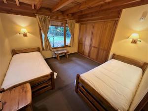 Postel nebo postele na pokoji v ubytování MODO PATAGONIA-Casa Enebro