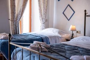Postel nebo postele na pokoji v ubytování Casa Aurora