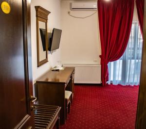 TV a/nebo společenská místnost v ubytování Hotel Rebis