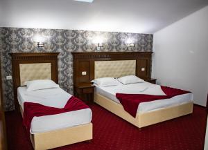 Postel nebo postele na pokoji v ubytování Hotel Rebis