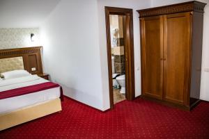 Postel nebo postele na pokoji v ubytování Hotel Rebis