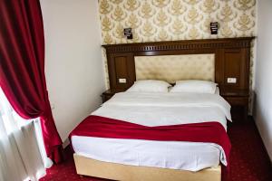 Postel nebo postele na pokoji v ubytování Hotel Rebis