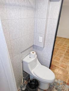 a bathroom with a white toilet in a room at Casa Nance Alojamientos UXMAL Suite Ejecutiva Centro Mercado 28 y ADO King Size in Cancún +9 photos