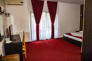 Postel nebo postele na pokoji v ubytování Hotel Rebis