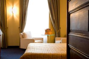 
Ein Bett oder Betten in einem Zimmer der Unterkunft Hotel International
