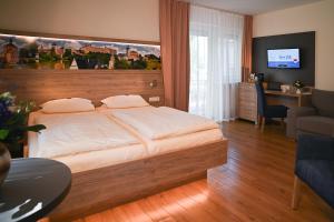 Postel nebo postele na pokoji v ubytování Hotel Ertl