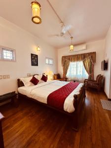 a large bedroom with a large bed in a room at Cleety's Residency in Cochin