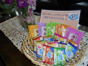 a basket filled with packets of candy on a table at Terminal Art Inn - Vacation STAY 97356v in Niigata