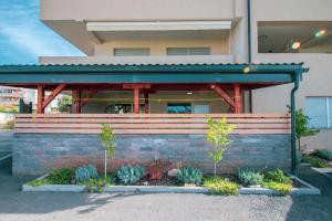 a building with a bench in front of it at Apartment Maja Medulin in Medulin