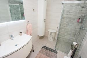 a bathroom with a sink and a shower at Apartment Maja Medulin in Medulin +21 photos
