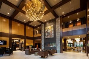 a lobby of a hotel with a chandelier at The Swiftwater in Swiftwater