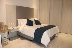 Postel nebo postele na pokoji v ubytování Sui Loft santa marta + 69 fotografií