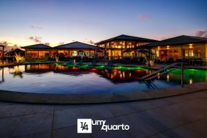 a large pool of water in front of a building at Ponta de Inhambupe Residences in Baixio