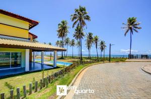 a villa with a view of the beach at Ponta de Inhambupe Residences in Baixio