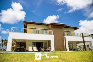 a villa with a view of a house at Ponta de Inhambupe Residences in Baixio