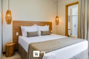 a bedroom with a large bed in a room at Ponta de Inhambupe Residences in Baixio