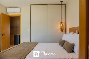 a bedroom with a large bed in a room at Ponta de Inhambupe Residences in Baixio