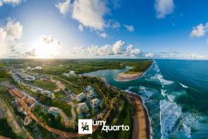 an aerial view of the shoreline of a resort at Ponta de Inhambupe Residences in Baixio
