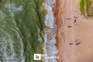 an overhead view of a beach with a group of people at Ponta de Inhambupe Residences in Baixio