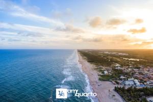 an aerial view of the ocean and a beach at Ponta de Inhambupe Residences in Baixio