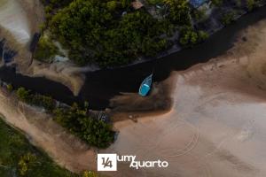 an aerial view of a boat in the water at Ponta de Inhambupe Residences in Baixio