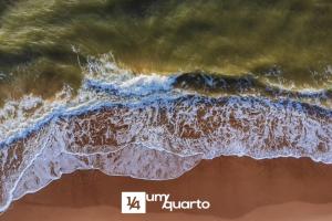 an aerial view of the ocean and the beach at Ponta de Inhambupe Residences in Baixio