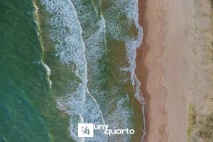 an overhead view of the beach and the ocean at Ponta de Inhambupe Residences in Baixio