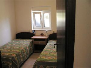 Posteľ alebo postele v izbe v ubytovaní Apartments Mako