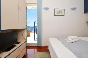 Posteľ alebo postele v izbe v ubytovaní Apartment Bozo