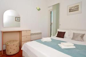 Posteľ alebo postele v izbe v ubytovaní Apartment Bozo