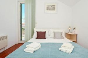 Posteľ alebo postele v izbe v ubytovaní Apartment Bozo