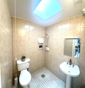 a bathroom with a toilet and a sink at 55 Malin Road in Moville