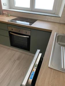 Kuchyň nebo kuchyňský kout v ubytování Il cortiletto sotto la Mole + 31 fotografií