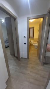 a hallway of a room with a bathroom and a toilet at Casa di Sara in Pescasseroli