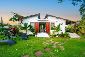 Taman di luar Casa paradise perto da praia Guarajuba - BA