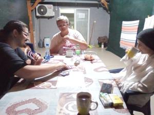 a group of people sitting around a table at Historia Hostel in Skopje