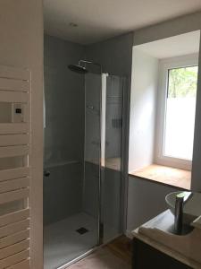 a bathroom with a shower and a sink at Les cimes de l'Oustal in Ax-les-Thermes +20 photos