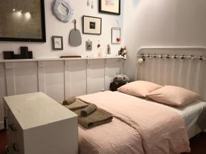 a small bedroom with a bed and a table at Sainte Anne in Apt