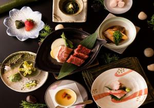 a group of plates of food on a table at ANA Crowne Plaza Resort Appi Kogen by IHG in Hachimantai