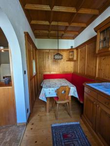 a small room with a table and a chair at Spacious Room in Tyrolean Flat in Innsbruck