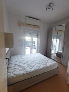 a bedroom with a large bed in a room at La casa di Enrico & Giusy in Passoscuro