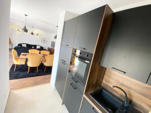 Kuchyň nebo kuchyňský kout v ubytování Apartment Tom