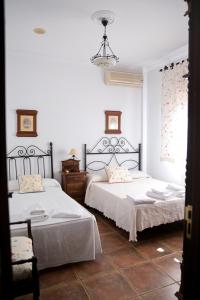 Postel nebo postele na pokoji v ubytování Casa Rural LA ENCINA
