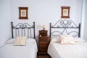Postel nebo postele na pokoji v ubytování Casa Rural LA ENCINA