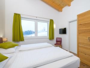 Postel nebo postele na pokoji v ubytování Hochkönigblick I