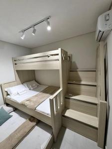 Ένα ή περισσότερα κρεβάτια σε δωμάτιο στο Cupe Paradise - Casa de Praia +14 φωτογραφίες