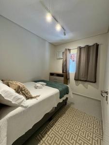 Ένα ή περισσότερα κρεβάτια σε δωμάτιο στο Cupe Paradise - Casa de Praia