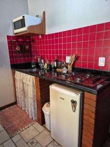 A cozinha ou cozinha compacta de Nina-Flor Pousada Lumiar