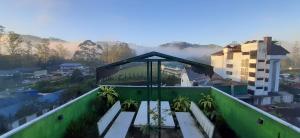 a view of a city from the roof of a building at Greenview holiday inn in Munnar